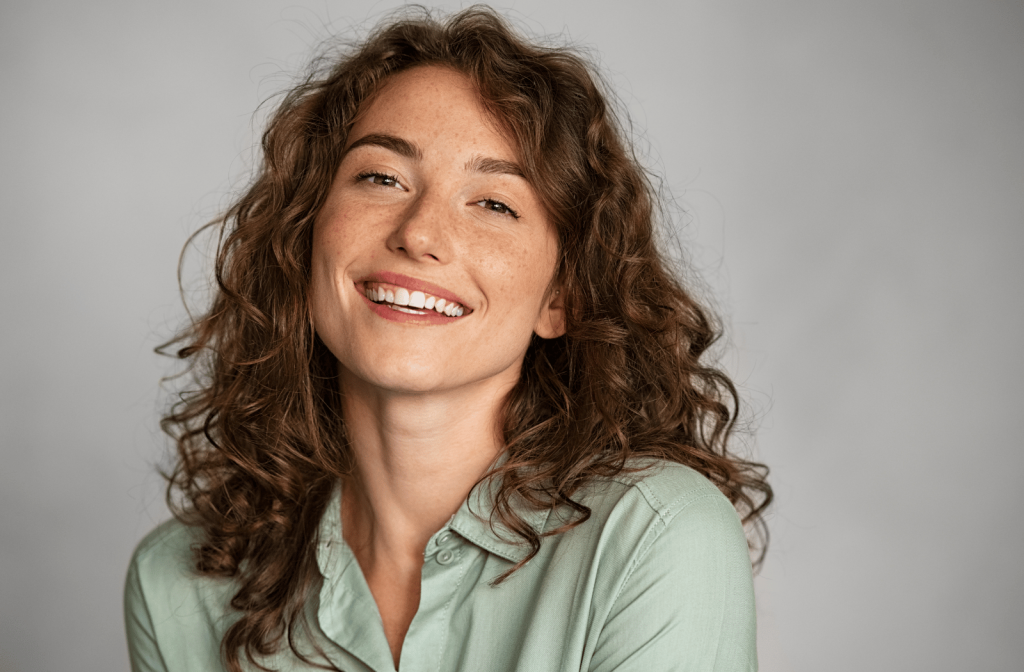 A young woman smiling towards the camera